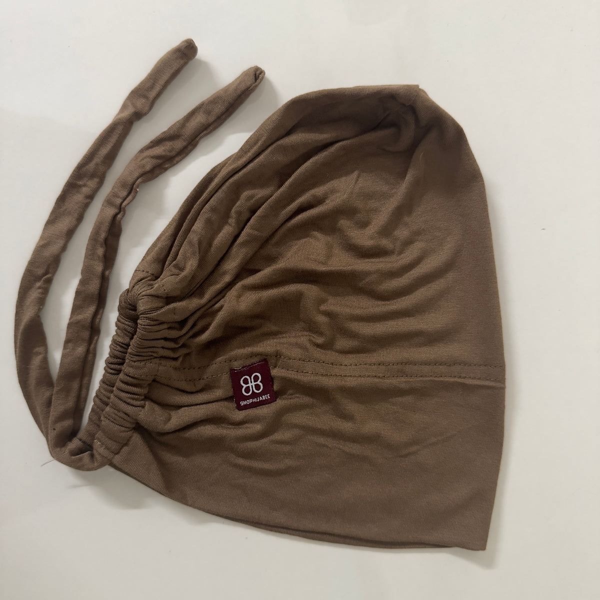 Adjustable Tie-Back Cap